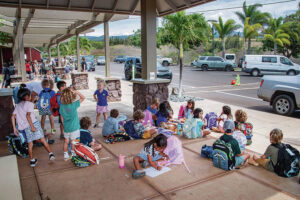 Kids with backpacks at Maui Prep